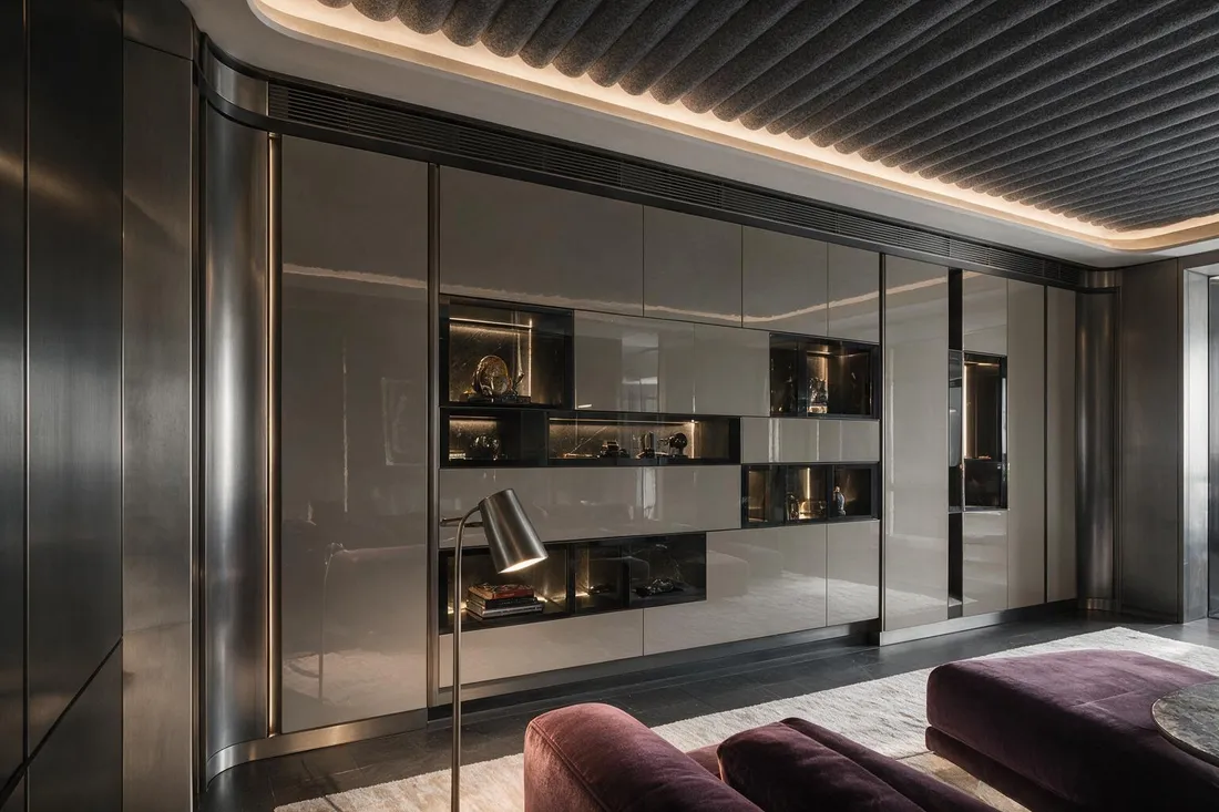 Luxury tech gaming room with a backlit high-gloss display wall and charcoal felt ceiling at night